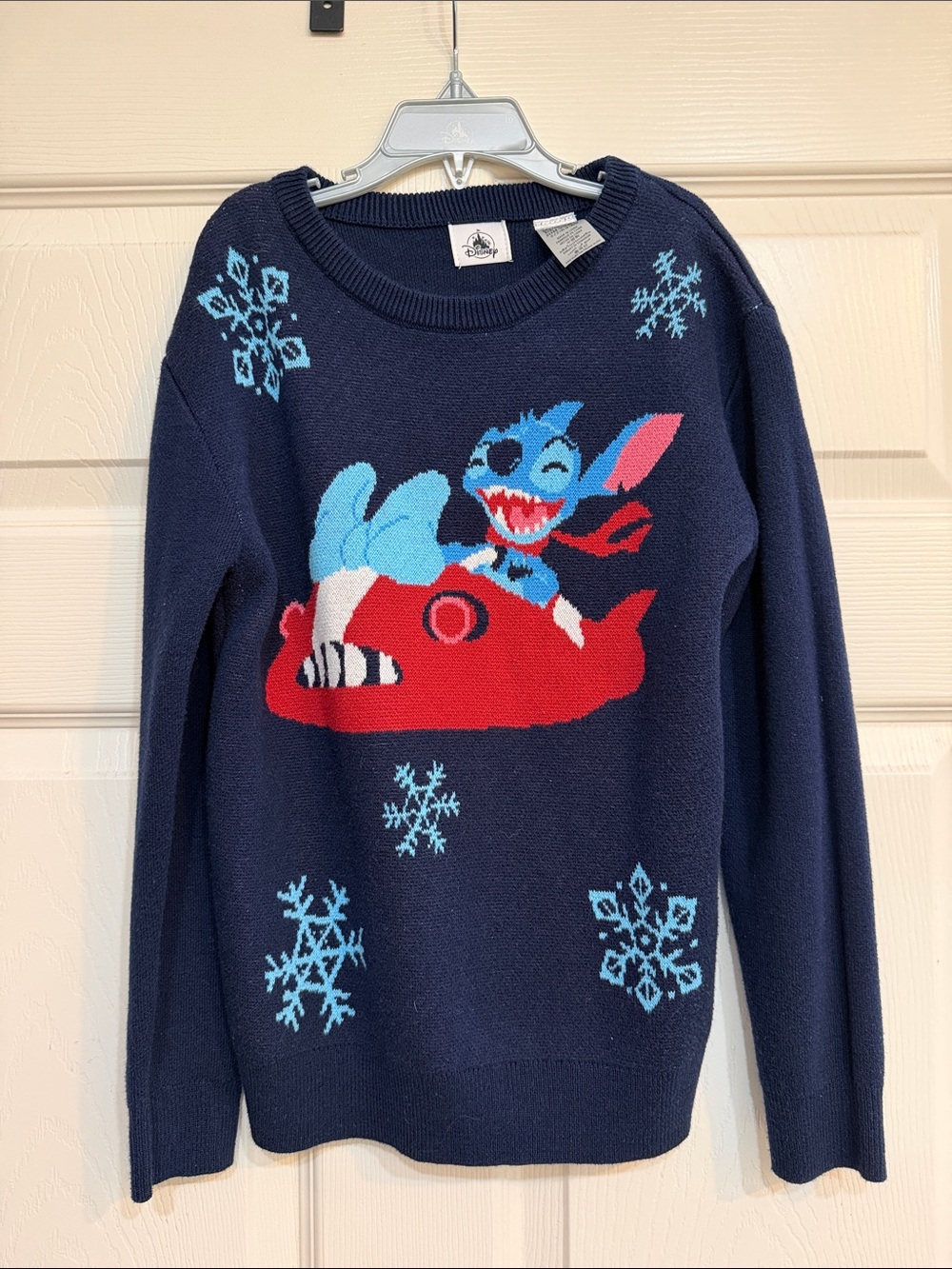 Disney Navy Blue Stitch Sweater with Red Sled and Light Blue Snowflakes